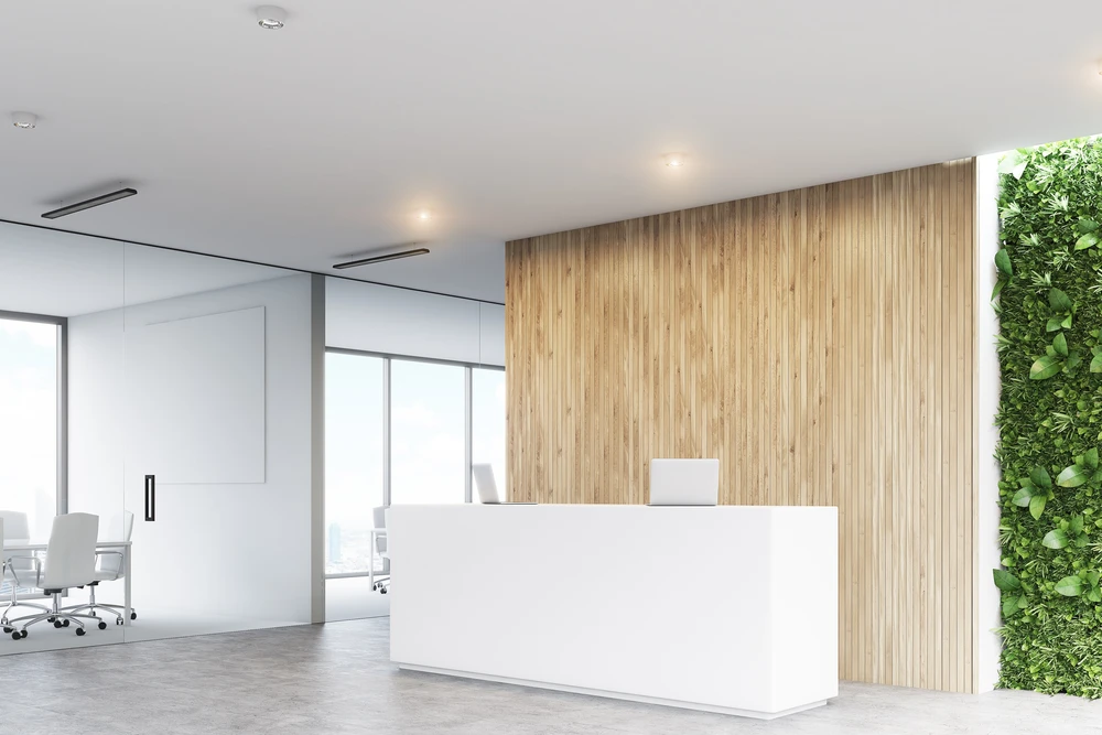 Espace de réception d'entreprise moderne avec banque d'accueil blanche minimaliste