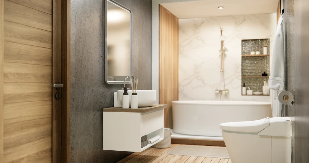 Salle de bain moderne avec baignoire îlot blanche, meuble vasque suspendu blanc et bois, miroir rétroéclairé, WC suspendu